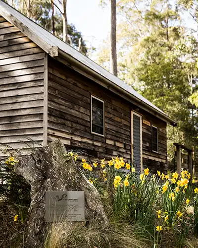 The old timber Settlers Hut is at Tin Dragon Cottage in North East Tasmania